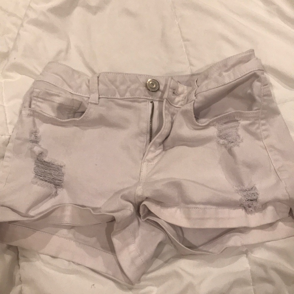 White ripped jean shorts
